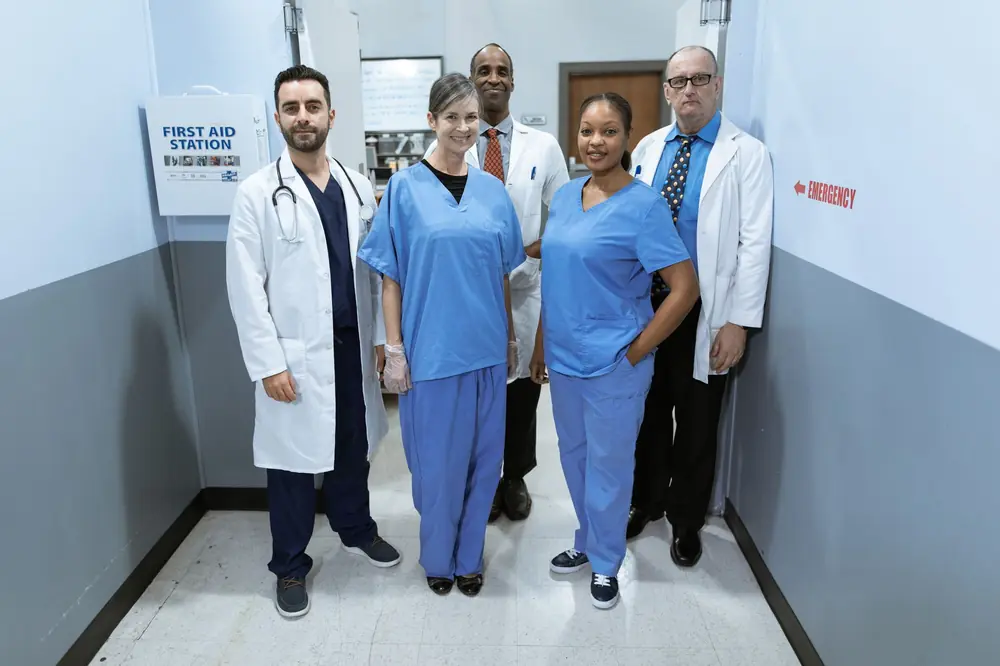 Doctors and nurses standing together in a hospital corridor
